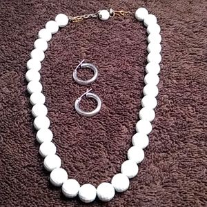 White bead necklace with small hoop earrings